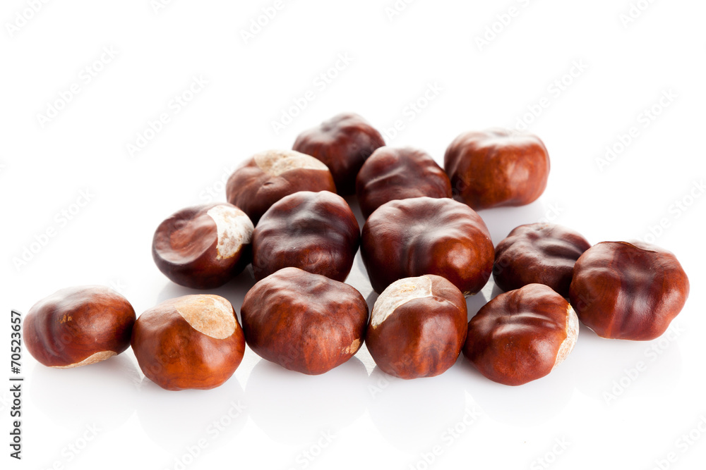 Chestnut on white background. ripe chestnuts Chestnut on white background. ripe chestnuts