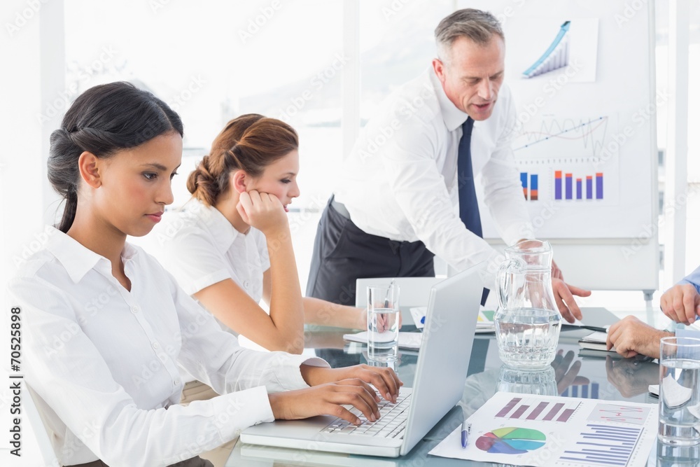 Businesswoman typing at a presentation Businesswoman typing at a presentation