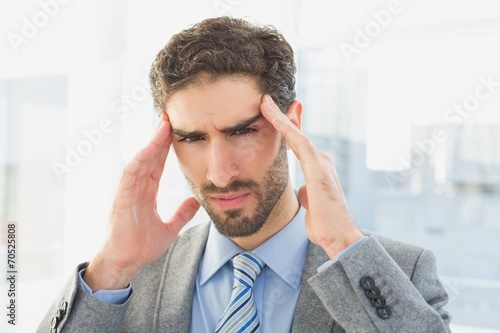 Businessman suffering from a headache