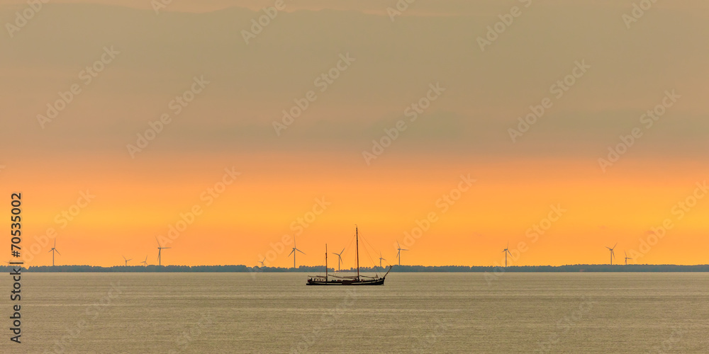 Panoramic image of a sailing boat at the Dutch Markermeer
