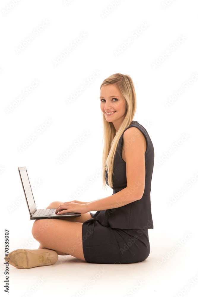 Blond Woman Sitting in Studio with Laptop Blond Woman Sitting in Studio with Laptop