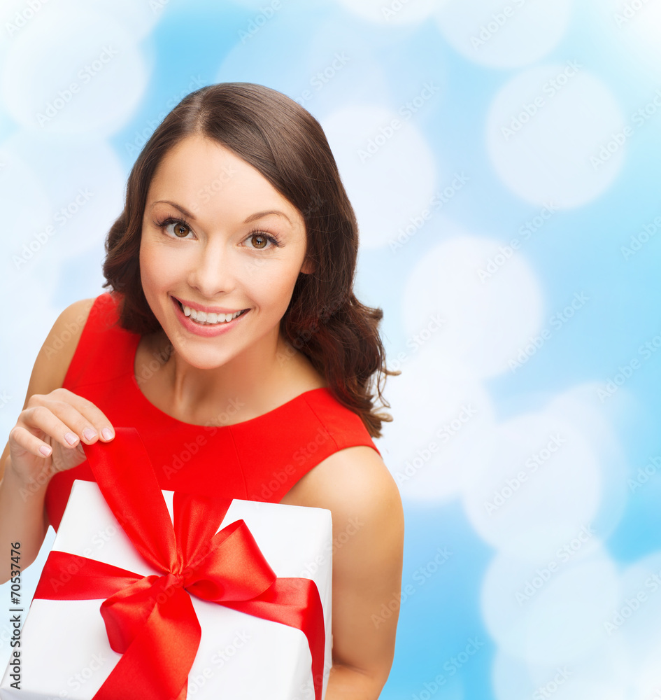 smiling woman in red dress with gift box smiling woman in red dress with gift box