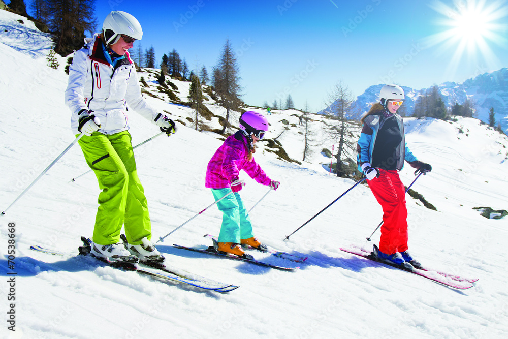 Skiing, skiers on mountainside