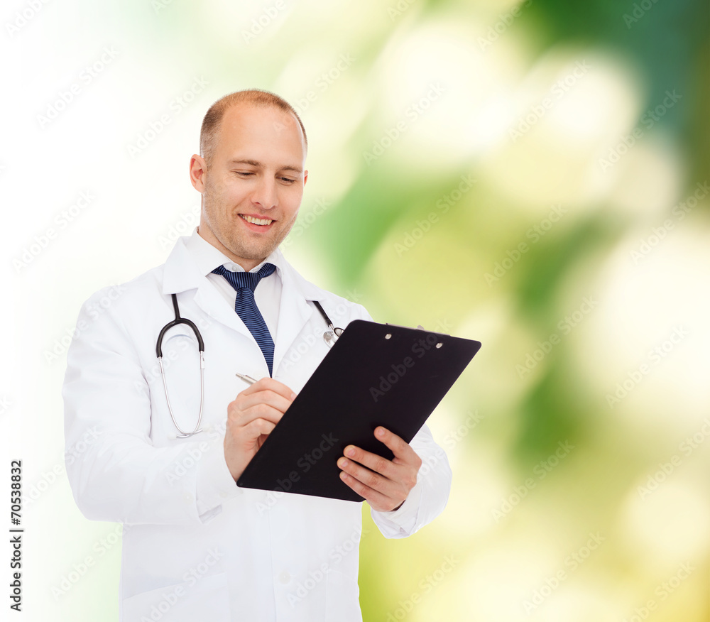 smiling male doctor with clipboard and stethoscope smiling male doctor with clipboard and stethoscope