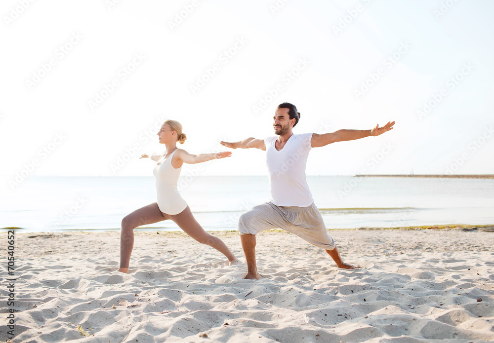 couple making yoga exercises outdoors couple making yoga exercises outdoors