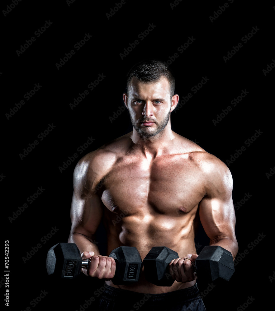 Man doing biceps curls in gym.