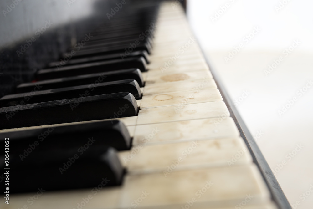 Low angle view of an old piano keyboard Low angle view of an old piano keyboard