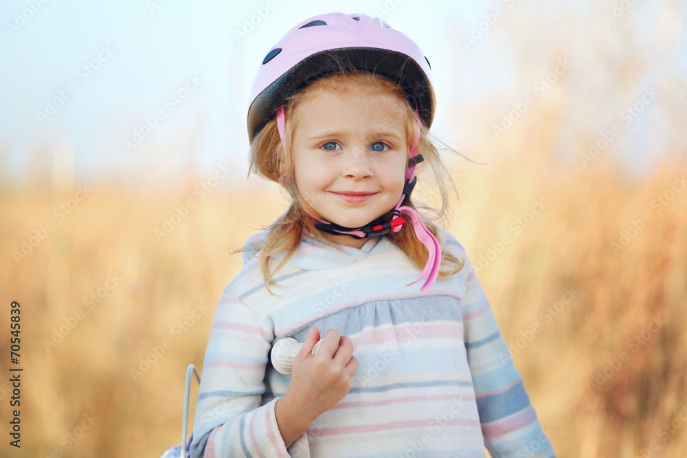 Small funny kid with bike posing. Small funny kid with bike posing.