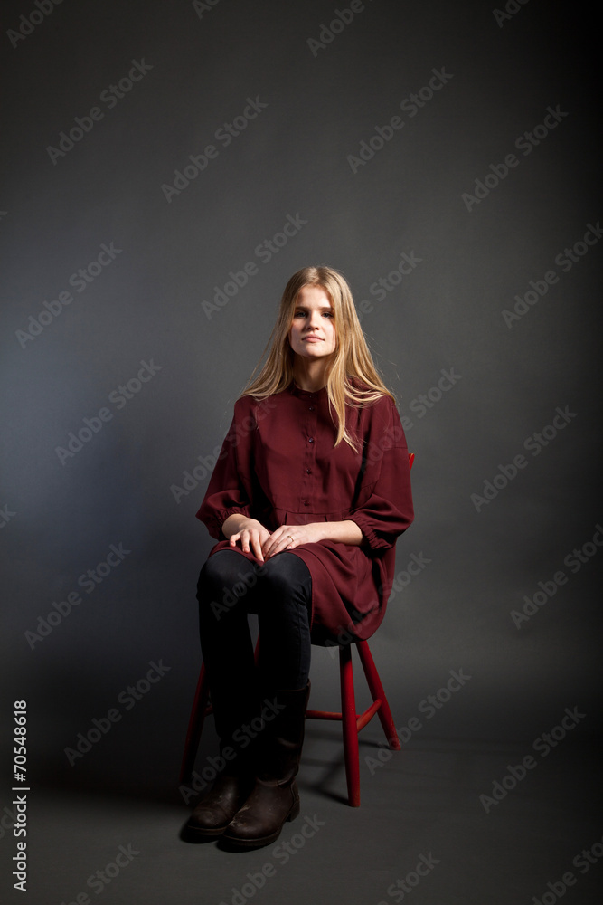 Scandinavian cute young girl sitting on a chair Scandinavian cute young girl sitting on a chair