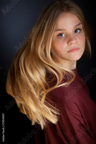 Scandinavian cute young girl portrait with hair in movement