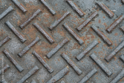 Old rusty metal plate to prevent slipping