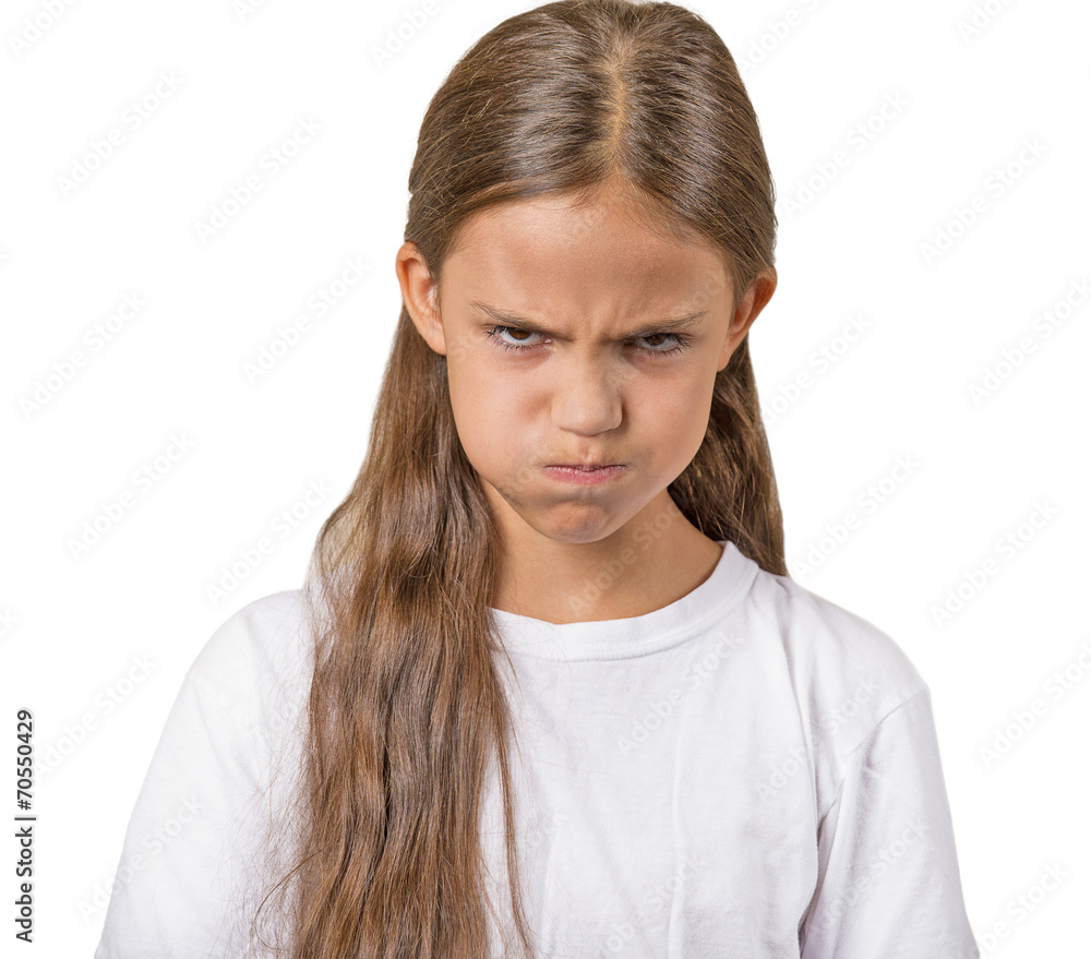 Headshot angry teenager girl isolated on white background Headshot angry teenager girl isolated on white background