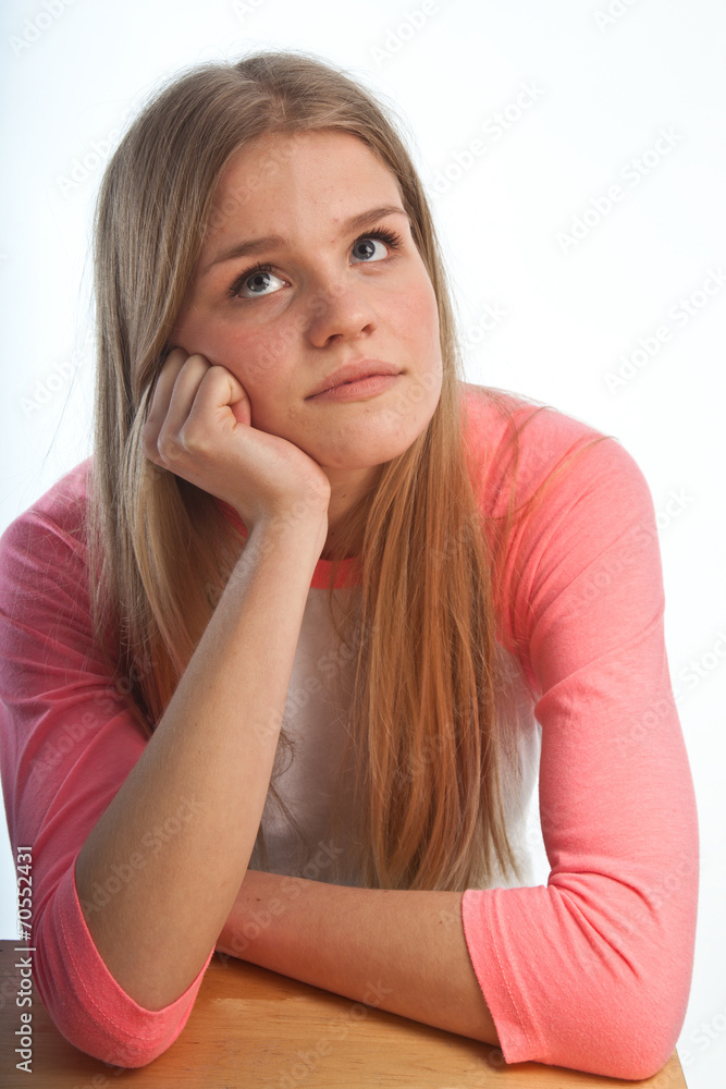 Scandinavian cute young girl portrait with head in one hand look Scandinavian cute young girl portrait with head in one hand look