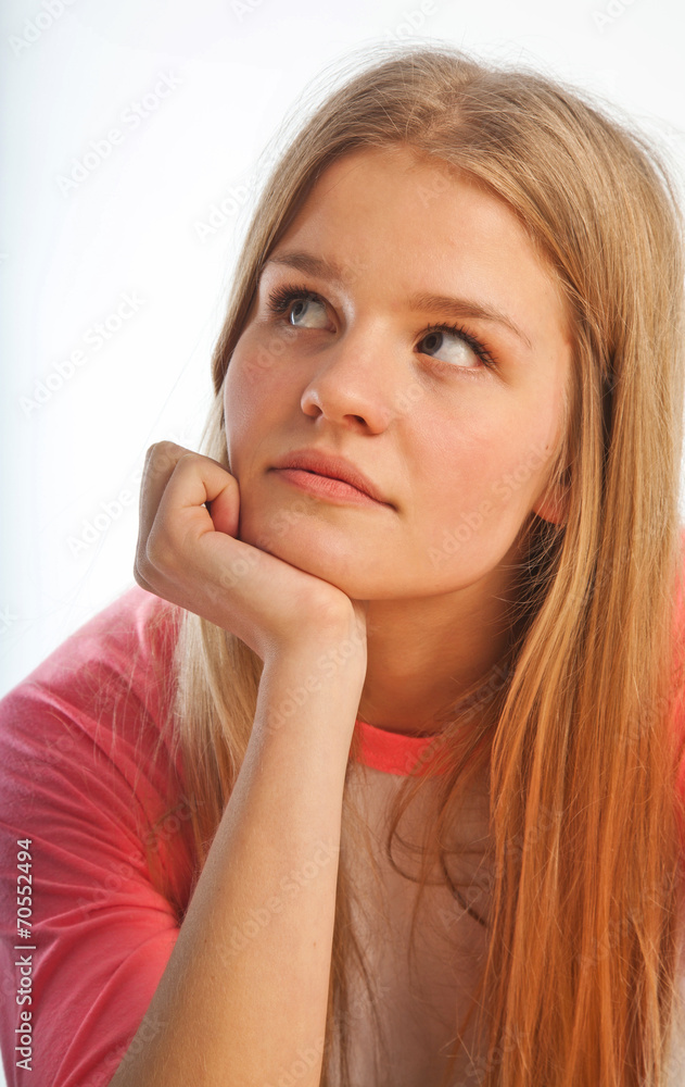 Scandinavian cute young girl portrait with head in one hand look Scandinavian cute young girl portrait with head in one hand look