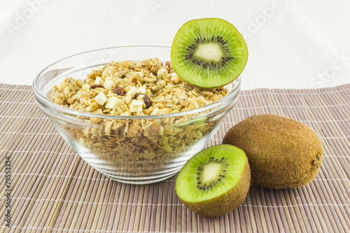 Cereal with kiwi on the mat