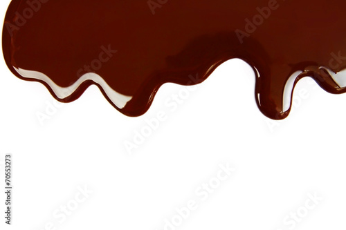 Melted chocolate dripping on white background