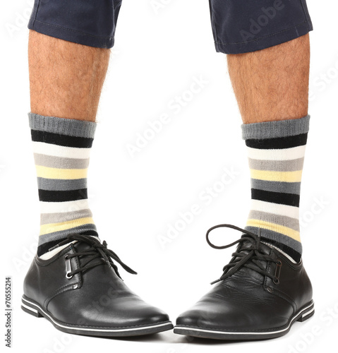 Man leg in suit and colorful socks, isolated on white