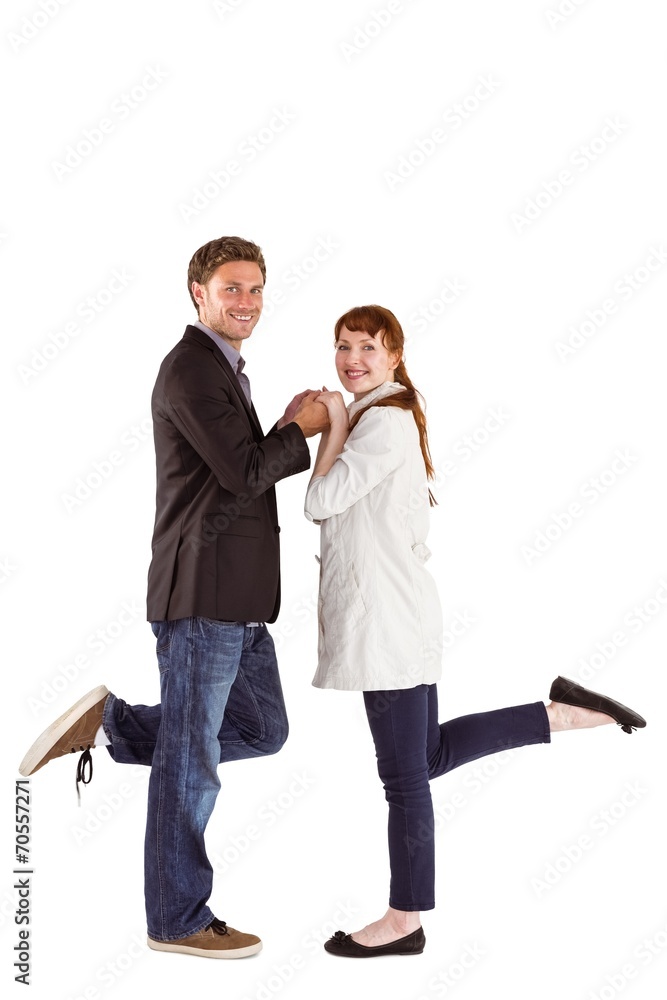 Smiling couple with raised legs