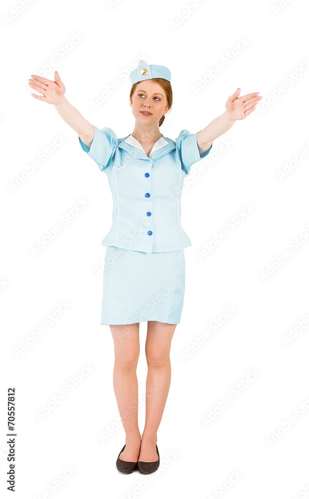 Pretty air hostess with arms raised Pretty air hostess with arms raised