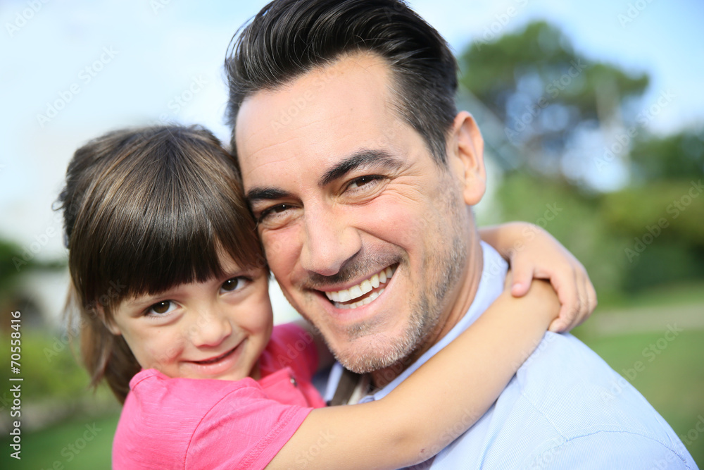 Portrait of little girl hugging her daddy Portrait of little girl hugging her daddy