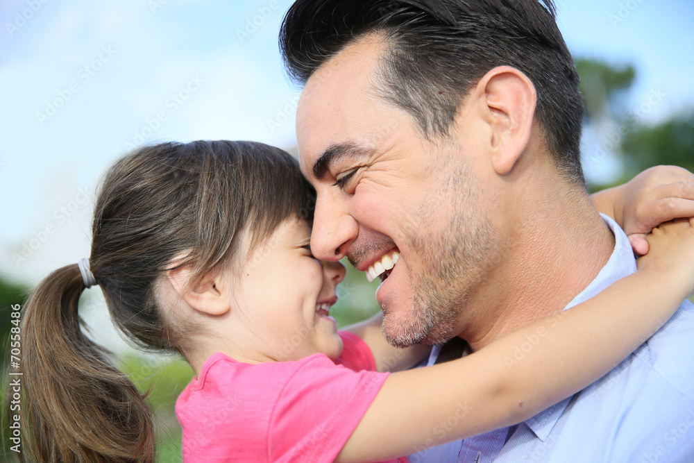 Portrait of little girl hugging her daddy Portrait of little girl hugging her daddy