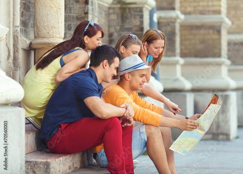 Group of youg college studens visiting Europe photo