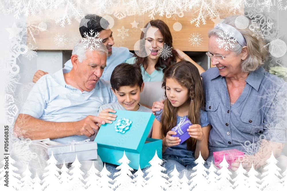 Extended family sitting on sofa with gift box