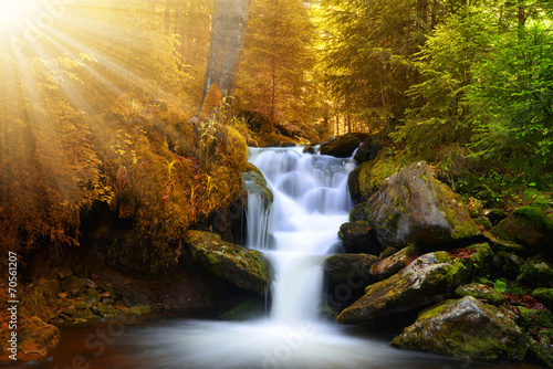 Autumnal landscape with waterfall photo