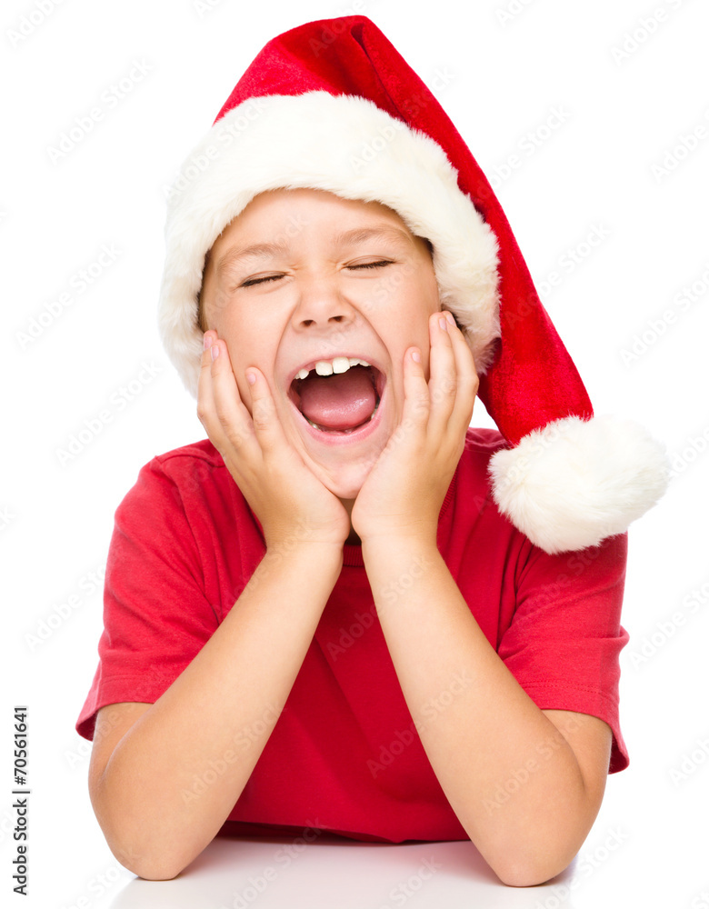 Little girl in santa hat is daydreaming Little girl in santa hat is daydreaming