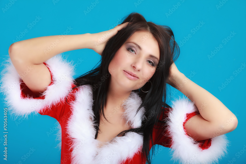 Portrait woman wearing santa clause costume on blue Portrait woman wearing santa clause costume on blue