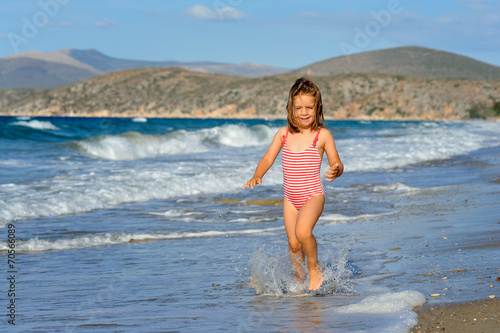 Toddler girl at beach