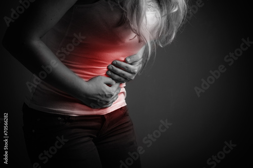 Lady abdominal pain. Black and white