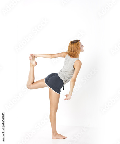 Young slim girl doing morning exercises