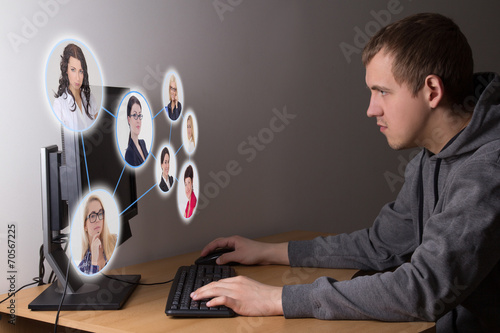 social media concept - young man using a computer