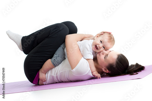 mother with baby do gymnast...