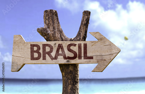 Brasil wooden sign with a beach on background photo