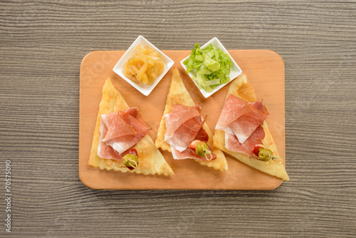 Antipasto di salumi , gnocco fritto e verdure photo