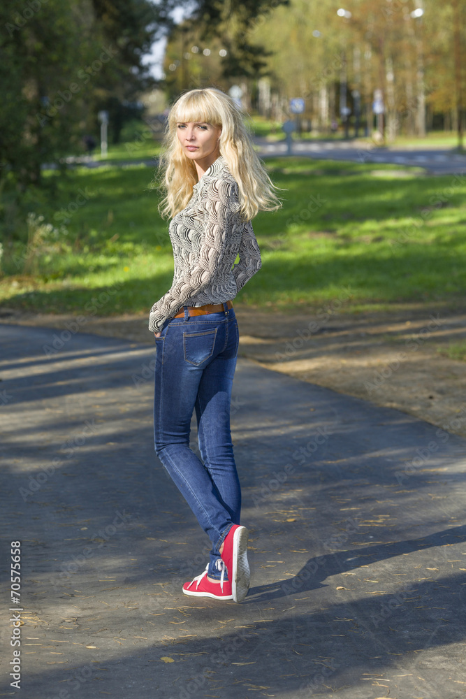 Beautiful young girl on a walk in the Park Beautiful young girl on a walk in the Park