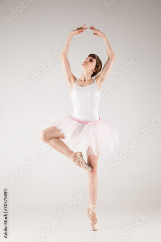 Ballet dancer in white tutu posing