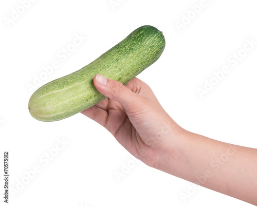 Hand holding cucumber on white background