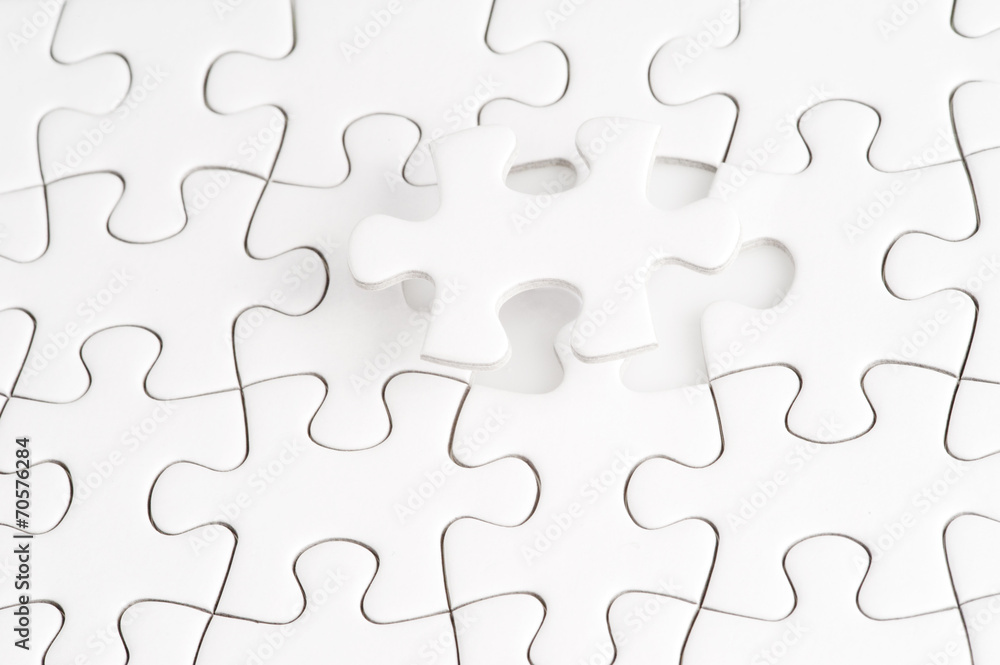 Missing jigsaw puzzle piece with light glow Missing jigsaw puzzle piece with light glow