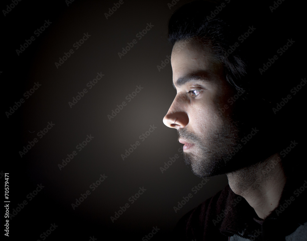 Dark portrait of a face in profile Dark portrait of a face in profile