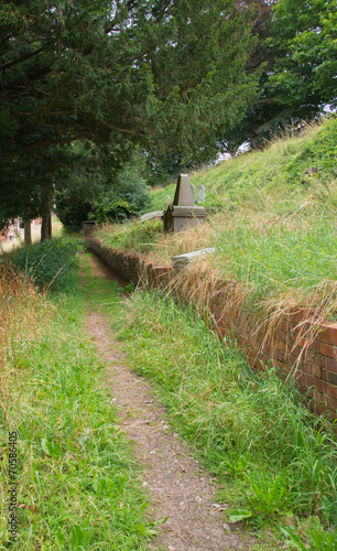 Public Path Cuts Through An Unused Cemetery