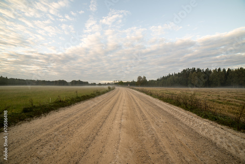 Majestic country landscape under morning sky with clouds.