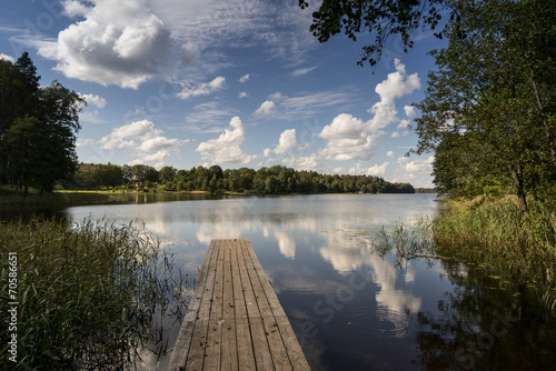 reflection of clouds in the lake with boardwalk