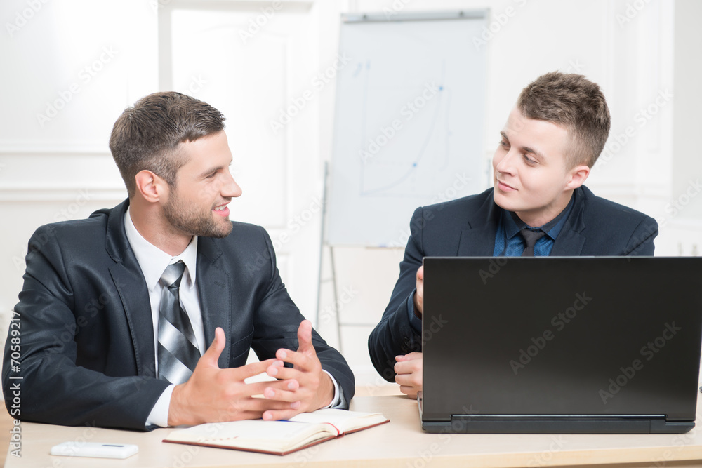 Waist-up portrait of two handsome businessmen in suits Waist-up portrait of two handsome businessmen in suits