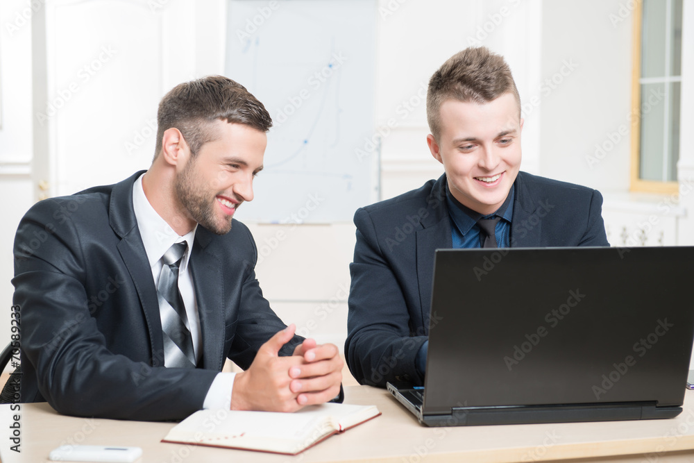 Waist-up portrait of two handsome businessmen in suits Waist-up portrait of two handsome businessmen in suits