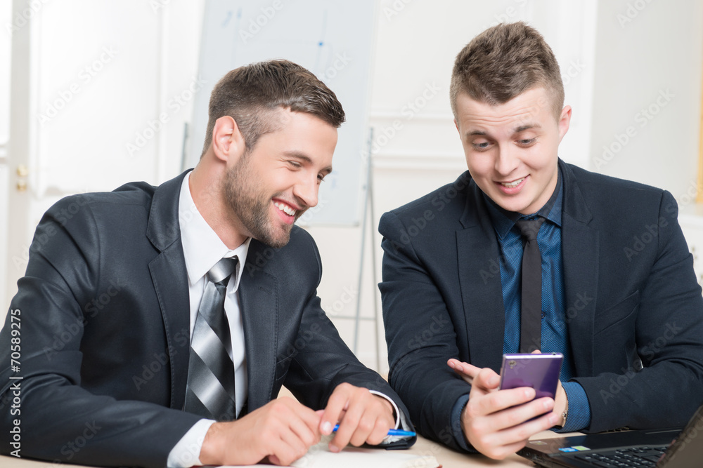 Waist-up portrait of two handsome businessmen in suits Waist-up portrait of two handsome businessmen in suits