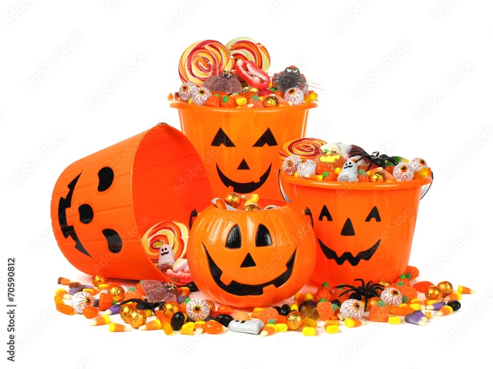 Obraz premium Group of Halloween Jack o Lantern pails with pile of candy