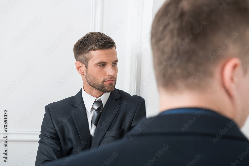 Close-up portrait of two handsome businessmen in suits Close-up portrait of two handsome businessmen in suits